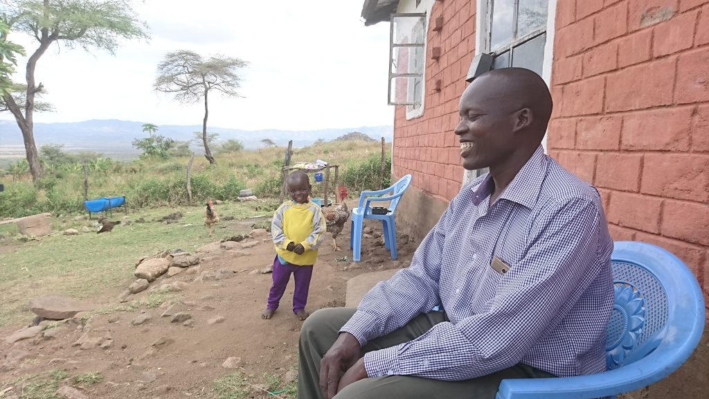 Vice principal Wilfred with smiling child